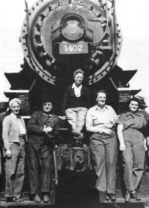 Women and high school students standing in front of train working to help with labor shortage during WW2